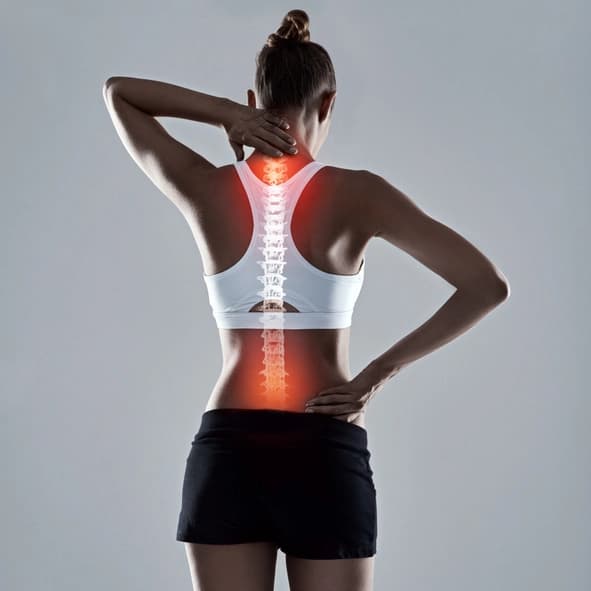 Back support brace worn on a knee for general back pain relief