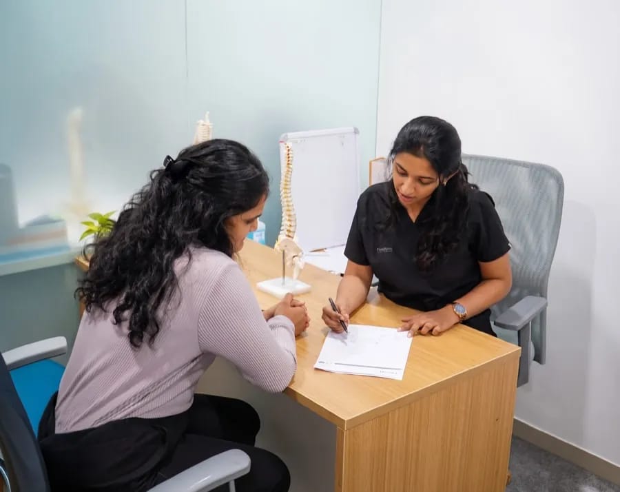 Physiotherapist conducting an expert clinical assessment