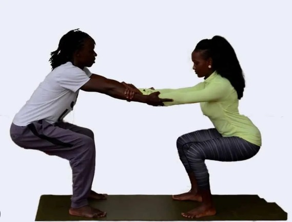 Squat Chest Opener couple yoga pose